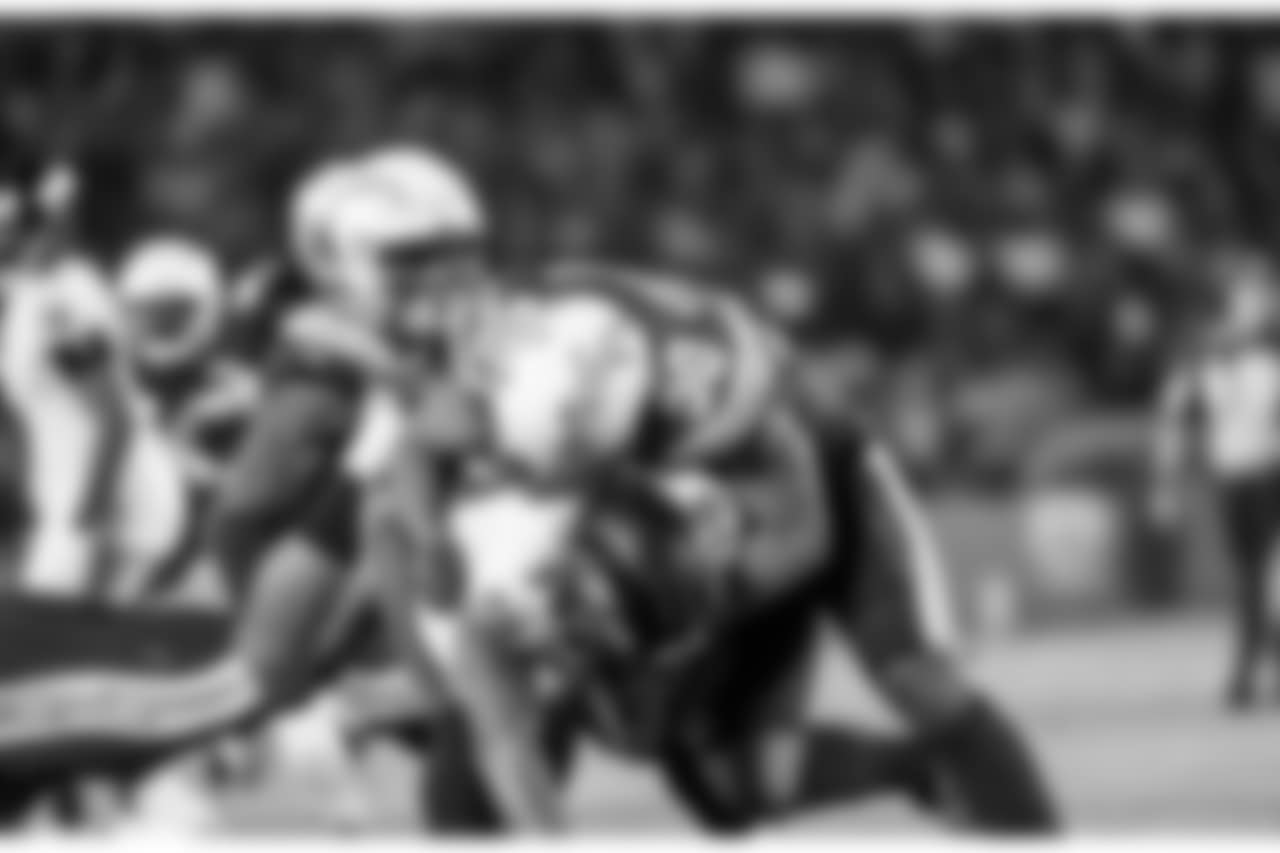 Hayes Pullard tackles Ravens RB Kenneth Dixon during the Week 16 matchup against the Baltimore Ravens at ROKiT Field at StubHub Center.