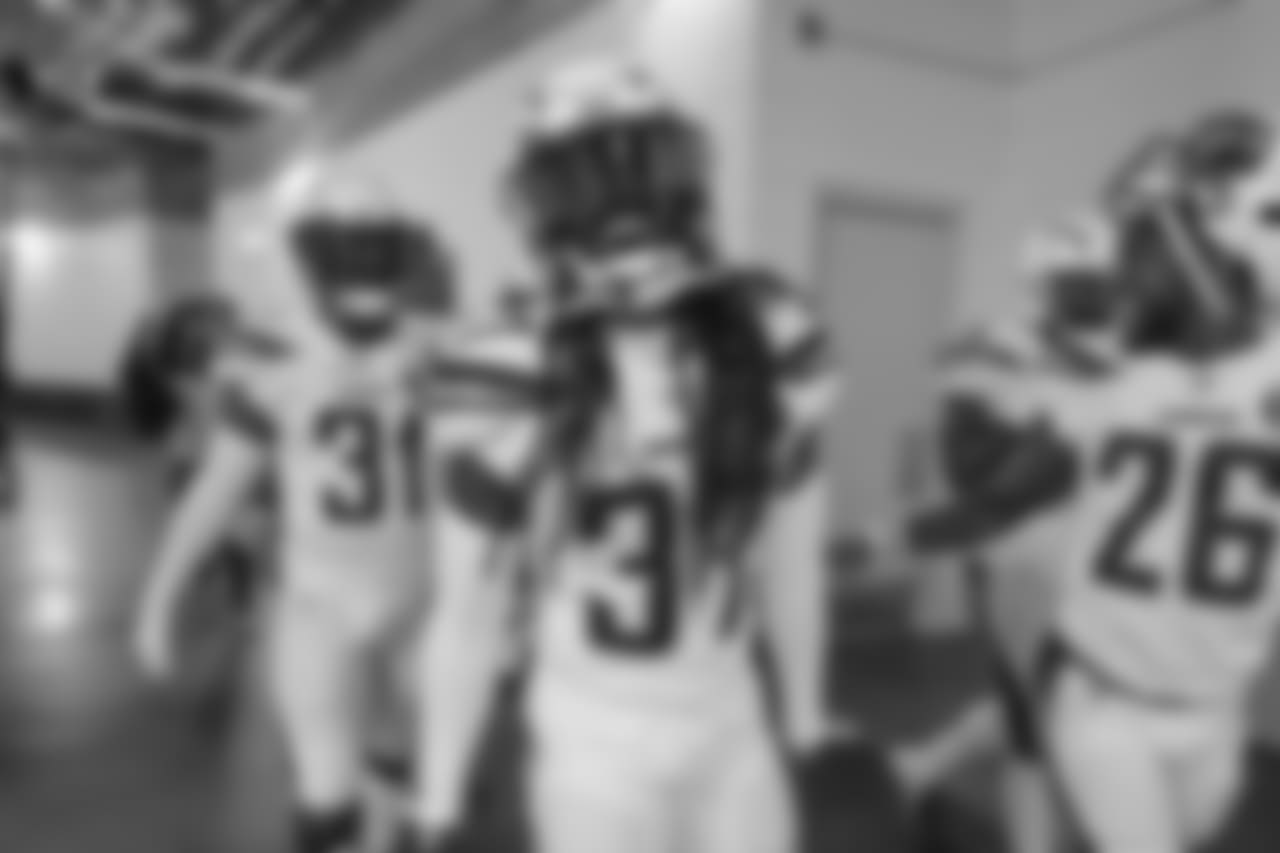 Adrian Phillips, Jahleel Addae and Casey Hayward walk out to the field to warm up before the Week 17 contest against the Denver Broncos.