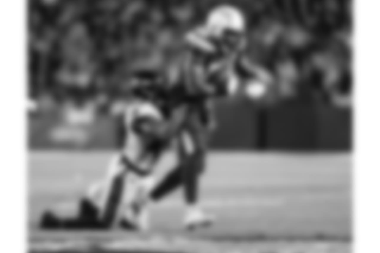 Virgil Green turns to run after catching a pass from Philip Rivers during the Week 16 matchup against the Baltimore Ravens at ROKiT Field at StubHub Center.