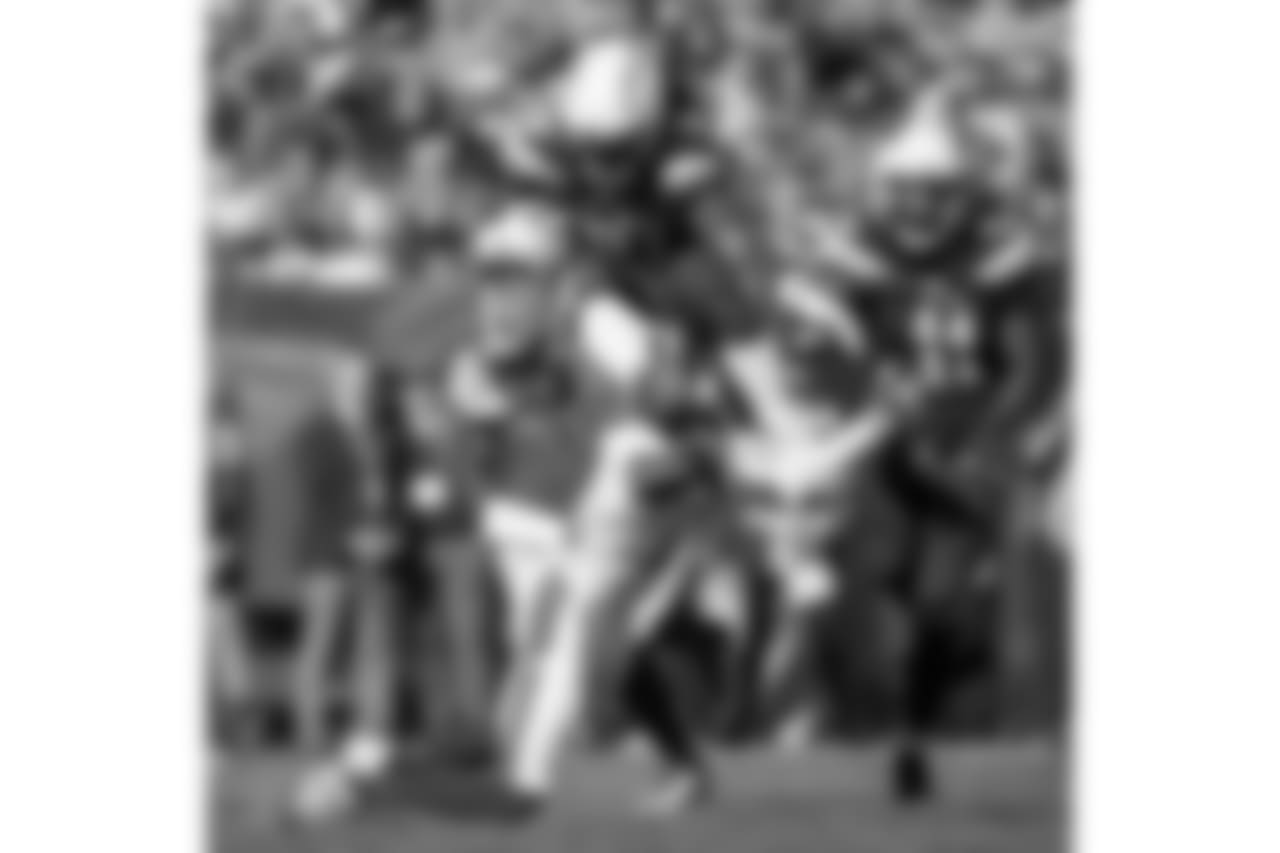 Running back Melvin Gordon leaps over a defender vs. the Cleveland Browns on Sun. Oct. 14, 2018 at FirstEnergy Stadium in Cleveland, OH.
