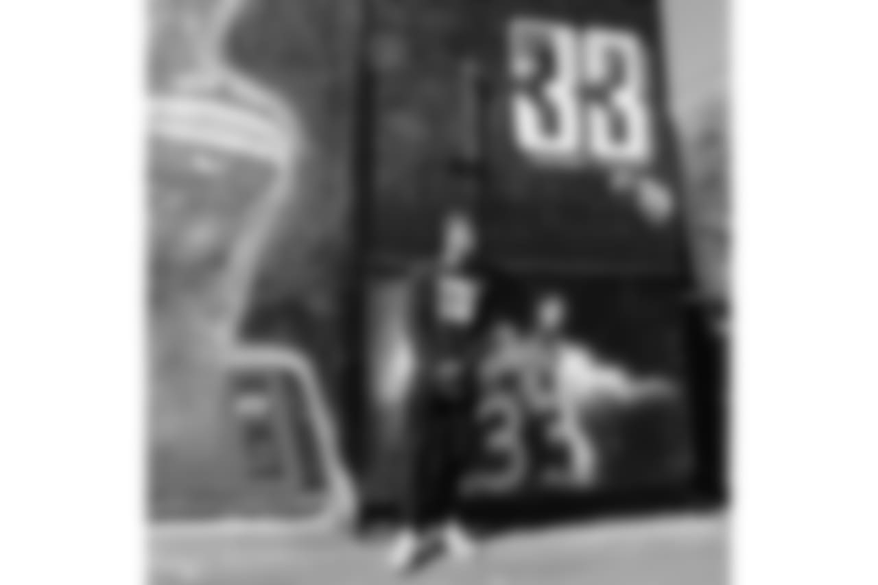 Derwin James poses in front of his very own mural in LA created by iconic muralist Jonas Never.