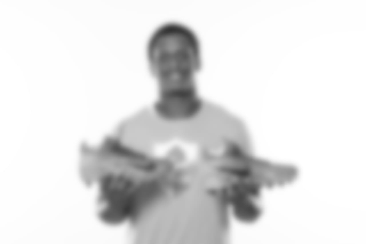 Geno Smith supporting the BLOOM Initiative, which aids young black men who are at risk with mentoring and character development opportunities.