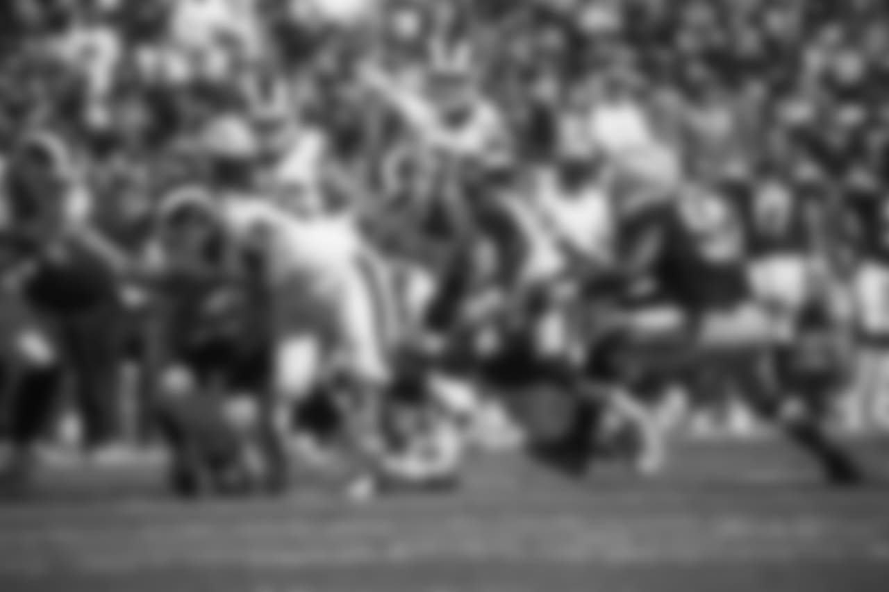 Brandon Mebane forces a fumble during the Bolts' matchup against the LA Rams at the LA Memorial Coliseum.