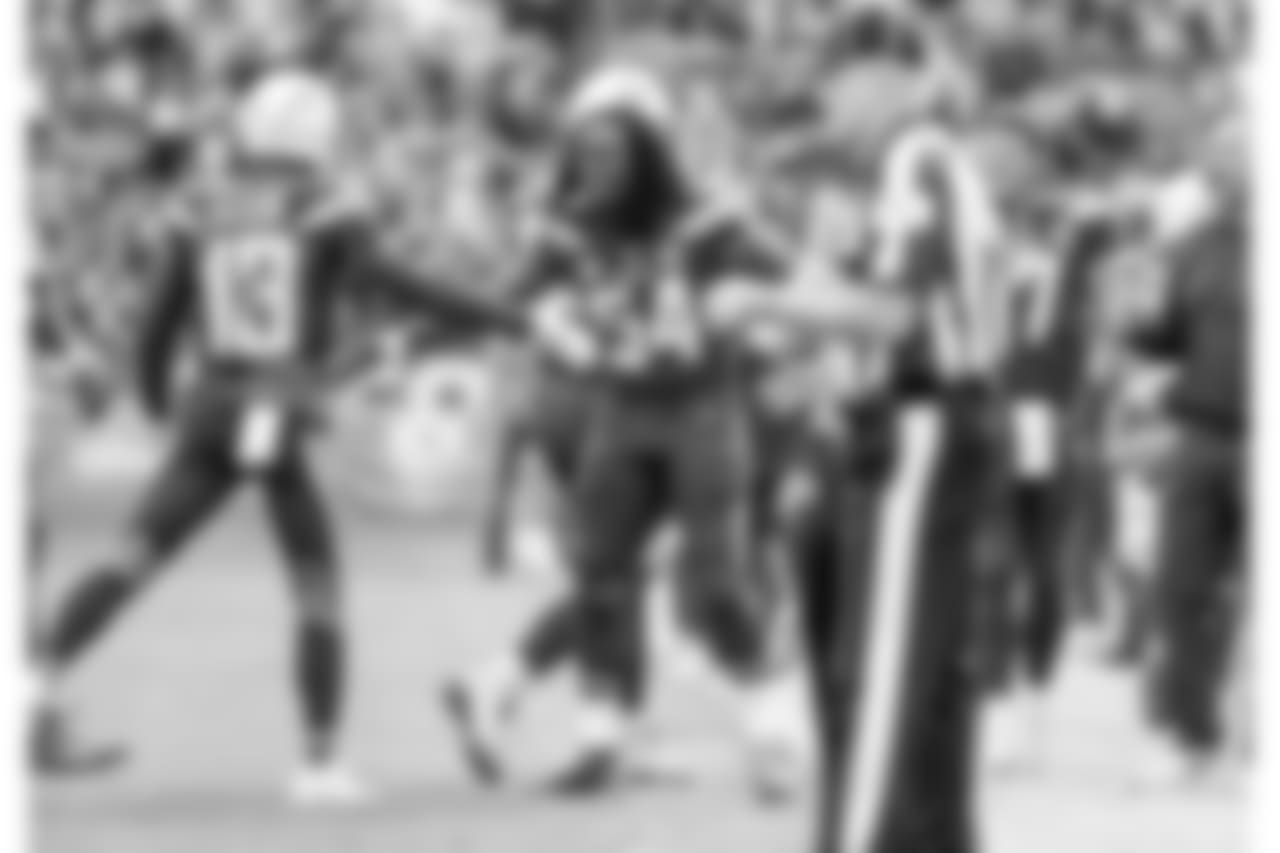 Keenan Allen and Melvin Ingram celebrate Allen's touchdown during the Week 14 matchup against the Cincinnati Bengals at ROKiT Field at StubHub Center.