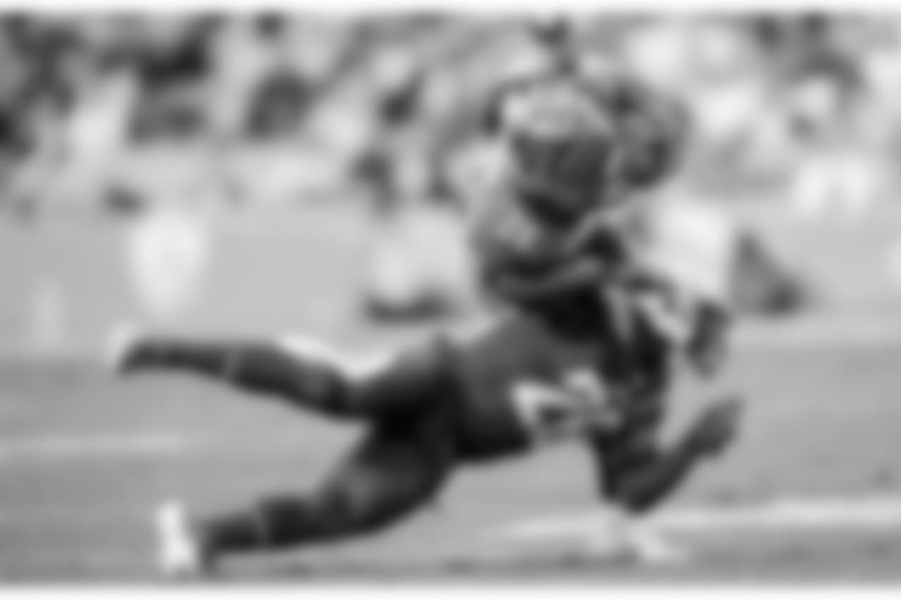 Desmond King tackles RB Joe Mixon during the Week 14 matchup against the Cincinnati Bengals at ROKiT Field at StubHub Center.