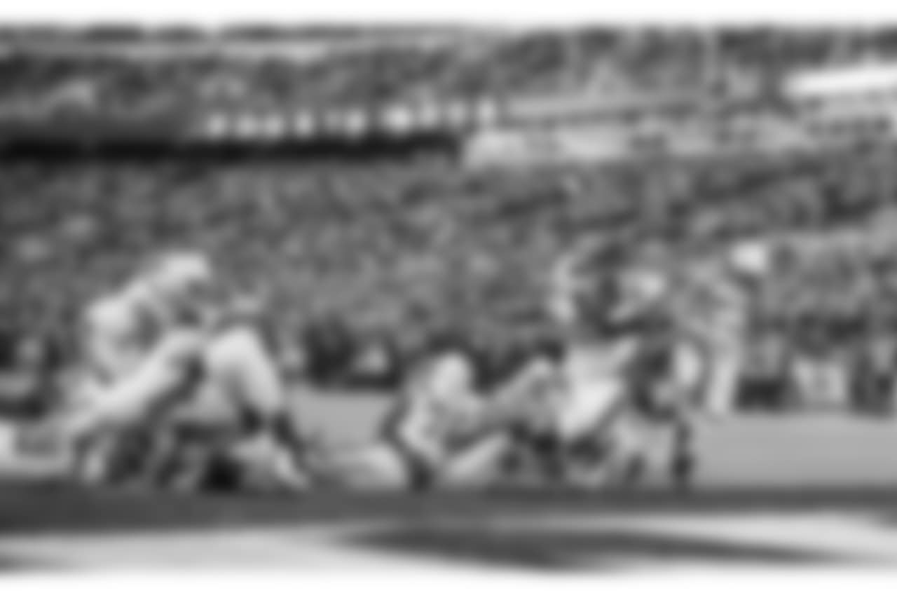 Melvin Gordon scores a touchdown during the Wild Card matchup against the Baltimore Ravens at M&T Bank Stadium.