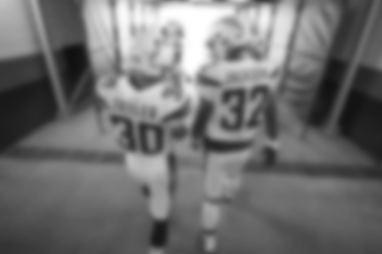 Austin Ekeler and Justin Jackson walk out to the field to warm up before the Week 17 contest against the Denver Broncos.