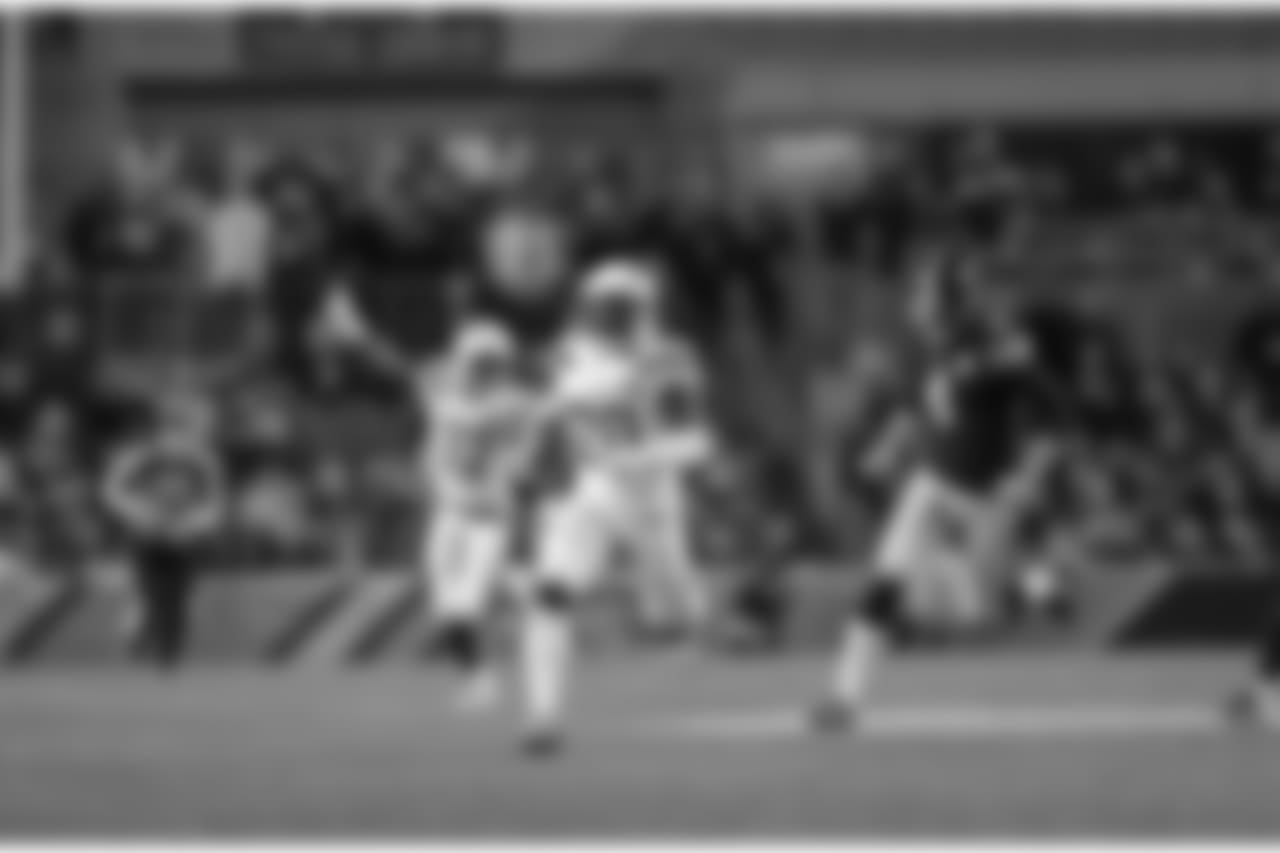 Desmond King returns a punt for a touchdown during the Week 13 matchup against the Pittsburgh Steelers at Heinz Field.