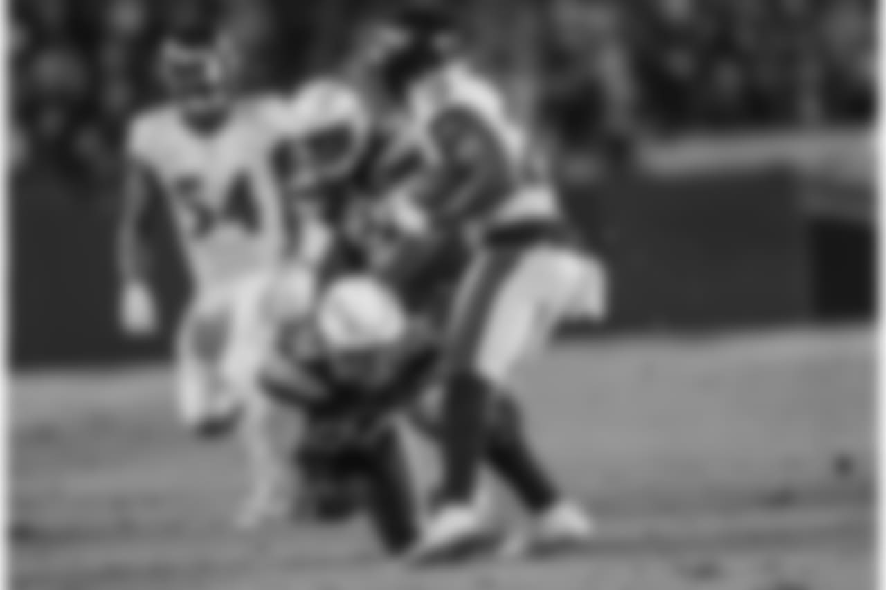 Derek Watt tackles during the Week 16 matchup against the Baltimore Ravens at ROKiT Field at StubHub Center.
