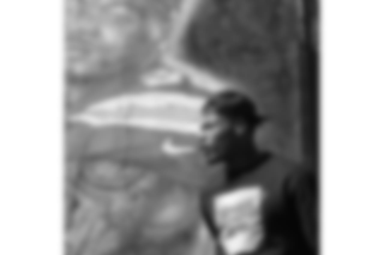 Derwin James poses in front of his very own mural in LA created by iconic muralist Jonas Never.
