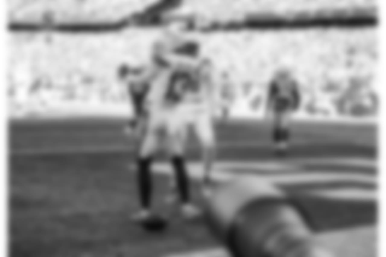 Keenan Allen celebrates scoring a touchdown during the Divisional Round matchup against the New England Patriots at Gillette Stadium.