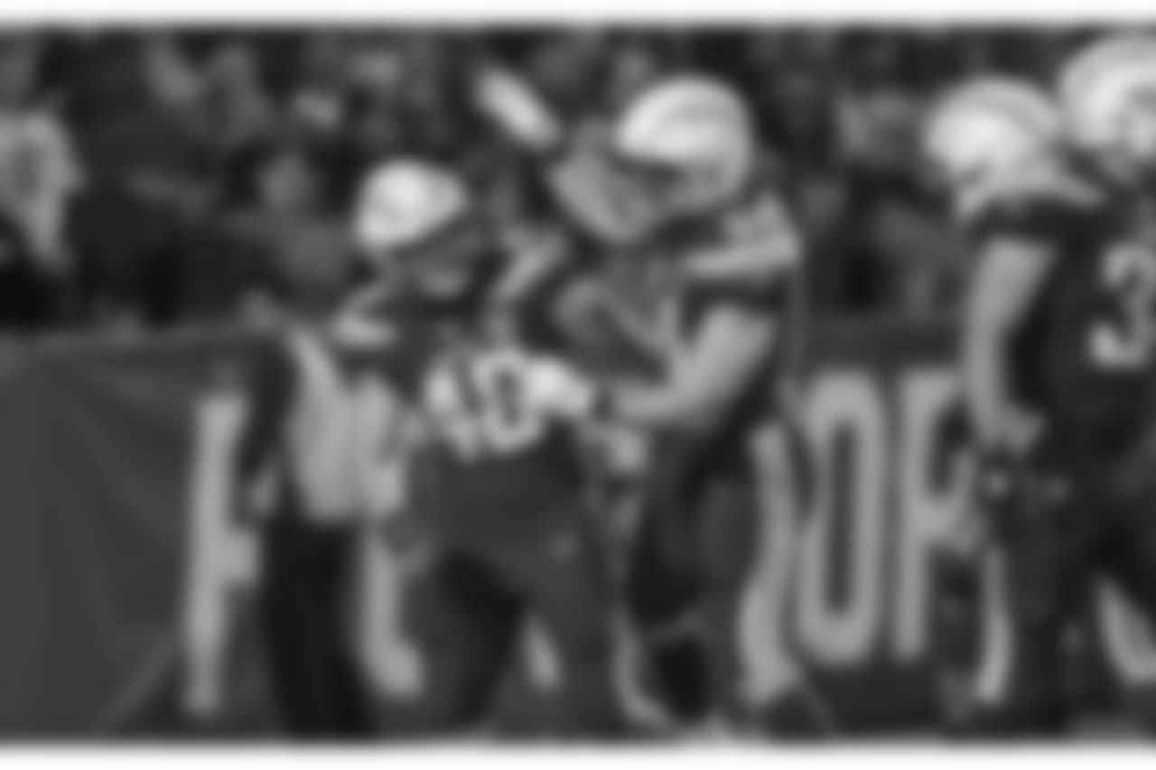 Nick Dzubnar and Kyle Emanuel celebrate during the Week 16 matchup against the Baltimore Ravens at ROKiT Field at StubHub Center.