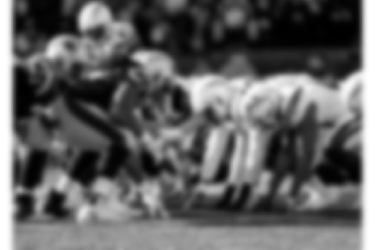 The Bolts line up before the snap during the Divisional Round matchup against the New England Patriots at Gillette Stadium.