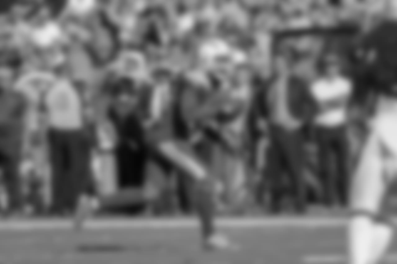 Keenan Allen celebrates catching a pass from Philip Rivers during the Week 12 matchup against the Arizona Cardinals at ROKiT Field at StubHub Center.