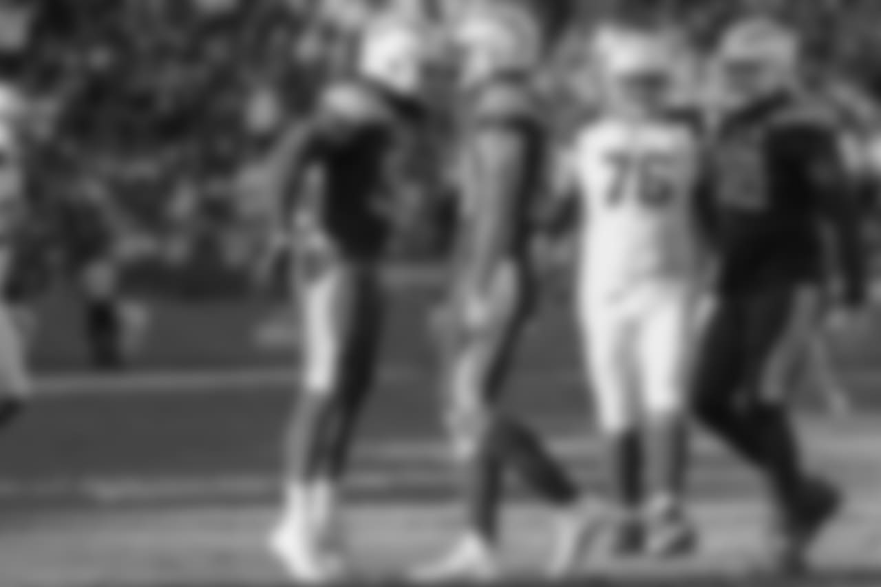 Melvin Ingram and Joey Bosa celebrate Bosa's second sack of the day during the Week 12 matchup against the Arizona Cardinals at ROKiT Field at StubHub Center.
