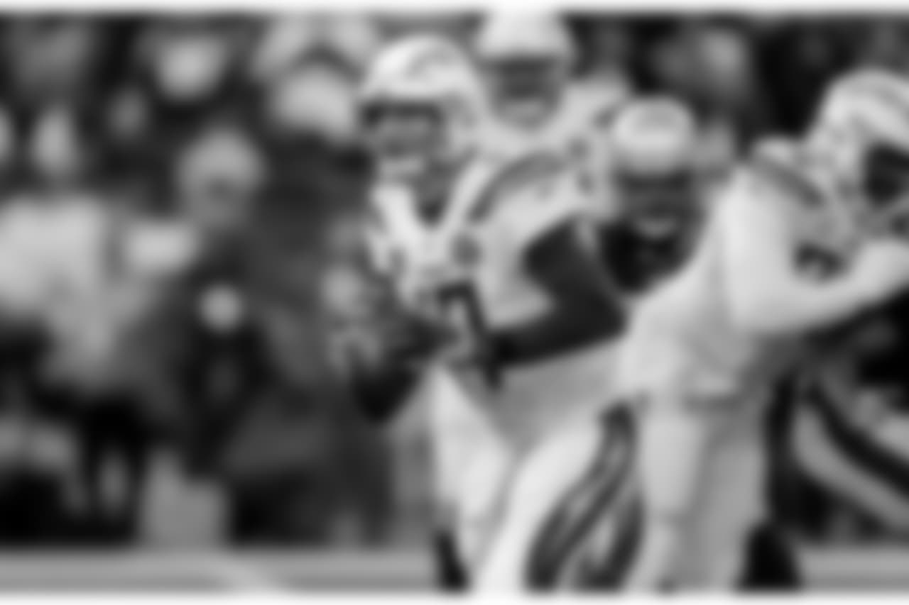 Philip Rivers holds the ball during the Divisional Round matchup against the New England Patriots at Gillette Stadium.