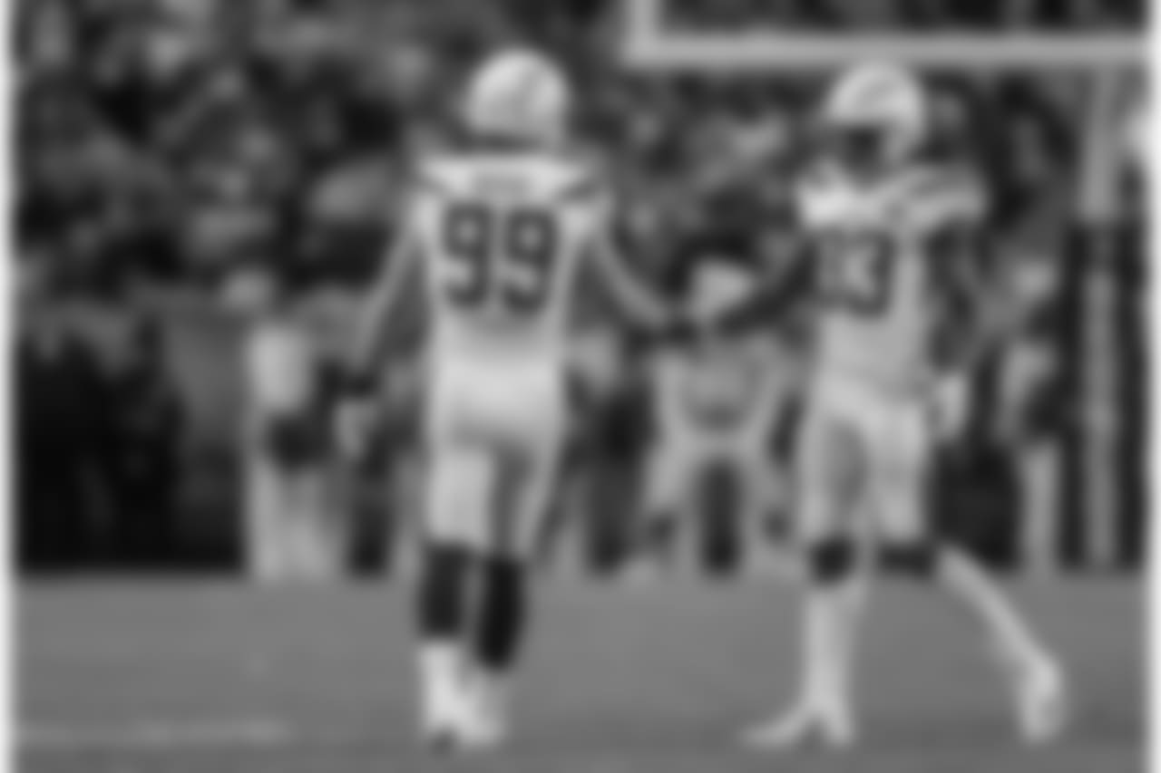 Joey Bosa and Derwin James shake hands after Bosa's sack of Case Keenum during the Week 17 contest against the Denver Broncos.