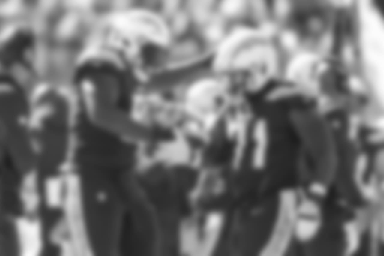 Justin Jones and Damion Square celebrate Square's sack during the Week 6 matchup against the Browns.