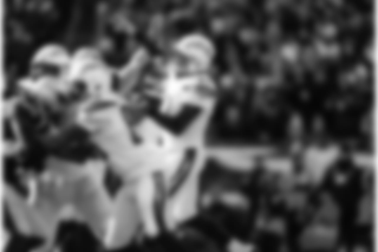 Philip Rivers throws the ball during the Divisional Round matchup against the New England Patriots at Gillette Stadium.