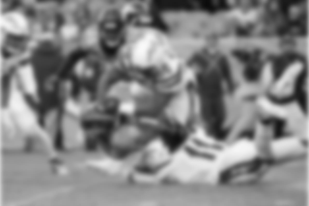 Kyle Wilson makes a tackle vs. the Denver Broncos at Broncos Stadium at Mile High on Sun. Dec. 30, 2018.