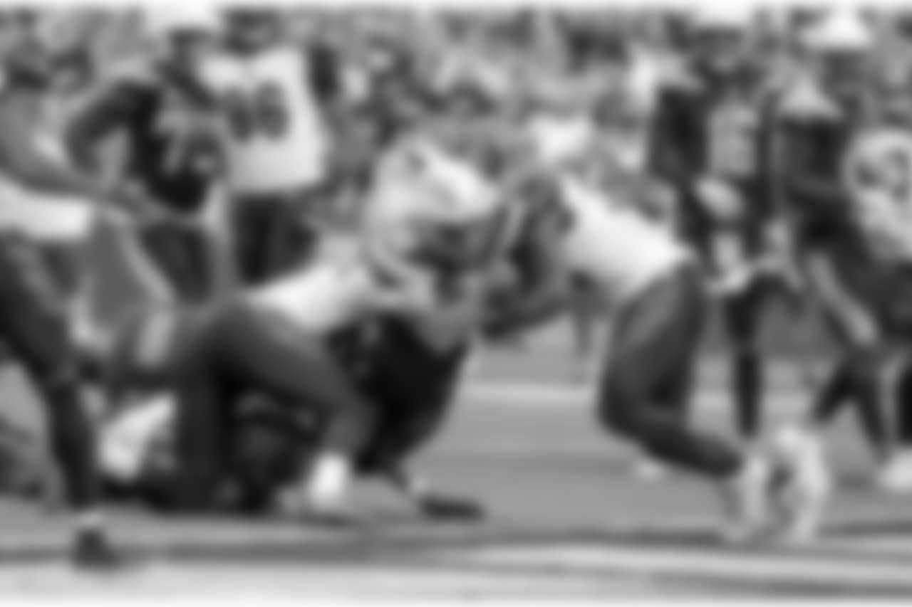 Austin Ekeler breaks through tackles to score a touchdown during the Week 14 matchup against the Cincinnati Bengals at ROKiT Field at StubHub Center.