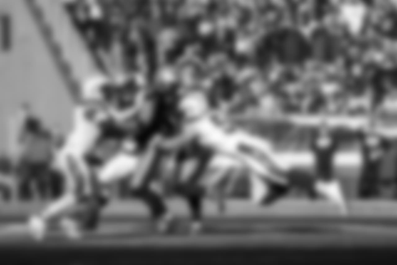 Kyle Emanuel tackles RB James White during the Divisional Round matchup against the New England Patriots at Gillette Stadium.