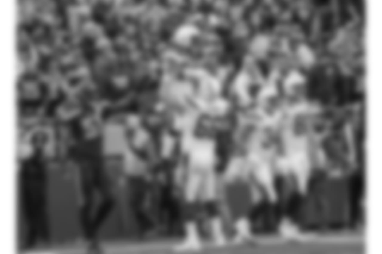 Dan Feeney and Melvin Gordon celebrate Gordon's touchdown during the Week 9 contest against the Seattle Seahawks at CenturyLink Field.