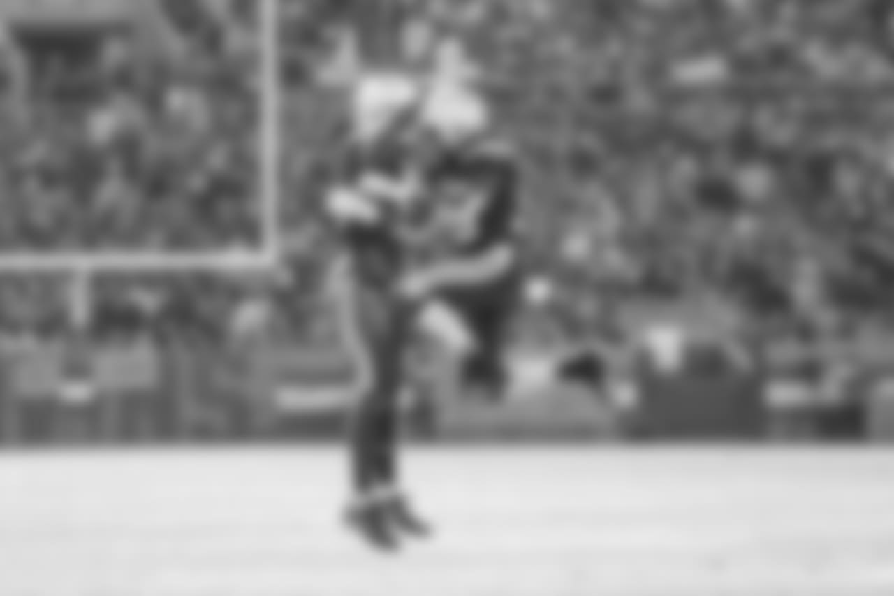 Mike Williams and Melvin Gordon celebrate Gordon's third touchdown of the day during the Week 6 matchup against the Browns.