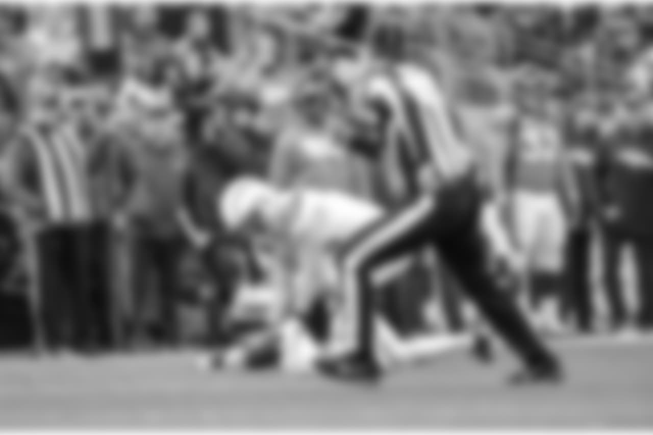 Kyle Emanuel scoops up a fumble and returns it for a touchdown during the Week 17 contest against the Denver Broncos.