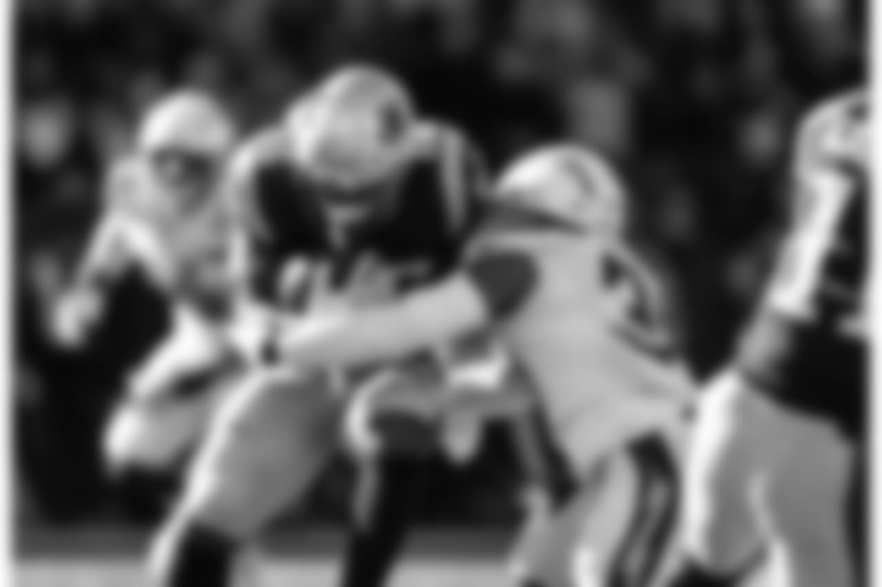 Adrian Phillips tackles RB Sony Michel during the Divisional Round matchup against the New England Patriots at Gillette Stadium.