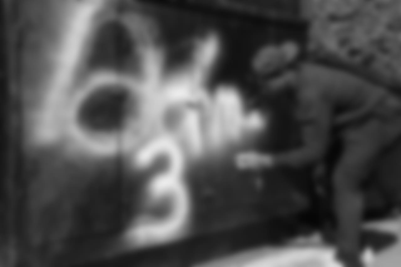 Derwin James signs the mural created by iconic muralist Jonas Never outside of Baby Blues BBQ in Venice Beach.