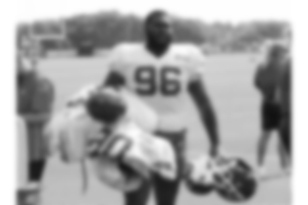 Kansas City Chiefs defensive tackle Dee Liner (96) carries others helmets and pads after practice 8/4/18 at Chiefs Training Camp at Missouri Western State University in St Joseph, Missouri