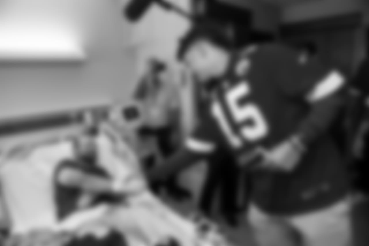 The Chiefs Community Caring Team, led by the Chiefs quarterbacks, visit The University of Kansas Health System to share hope and sign autographs for those fighting medical battles, including those in the oncology unit.