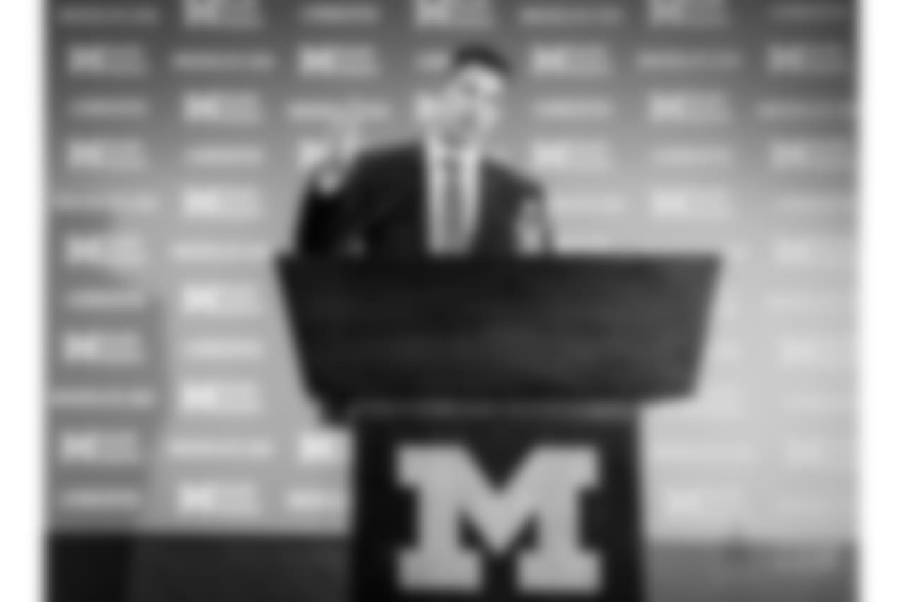 Doug Nussmeier gestures as he addresses the media as Michigan's offensive coordinator and quarterbacks coach during a news conference at the Junge Center in Ann Arbor, Mich., Friday, Jan. 10, 2014. Nussmeier is the former Alabama offensive coordinator. (AP Photo/Carlos Osorio)