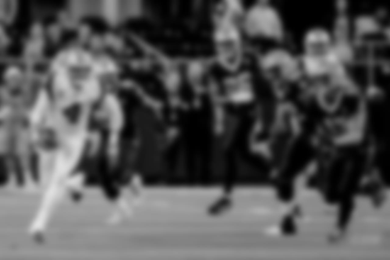 Dallas Cowboys quarterback Dak Prescott (4) scramble against the New Orleans Saints in the first half of an NFL football game, in Arlington, Texas, Thursday, Nov. 29, 2018. (AP Photo/Ron Jenkins)