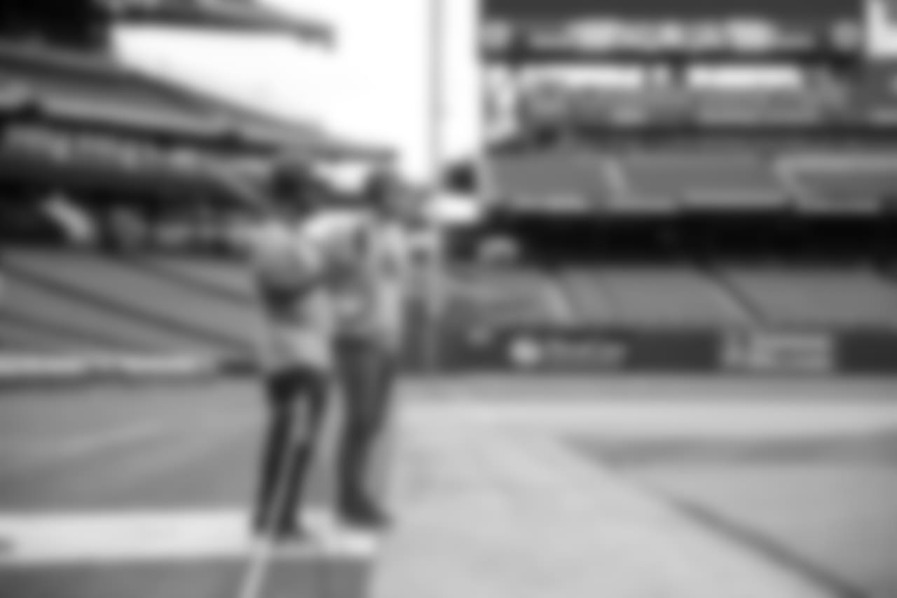 Clement and Lovato watch their teammate at bat