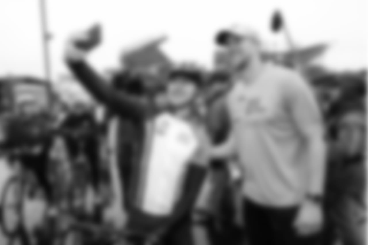 A lucky rider takes a picture with Nick Foles