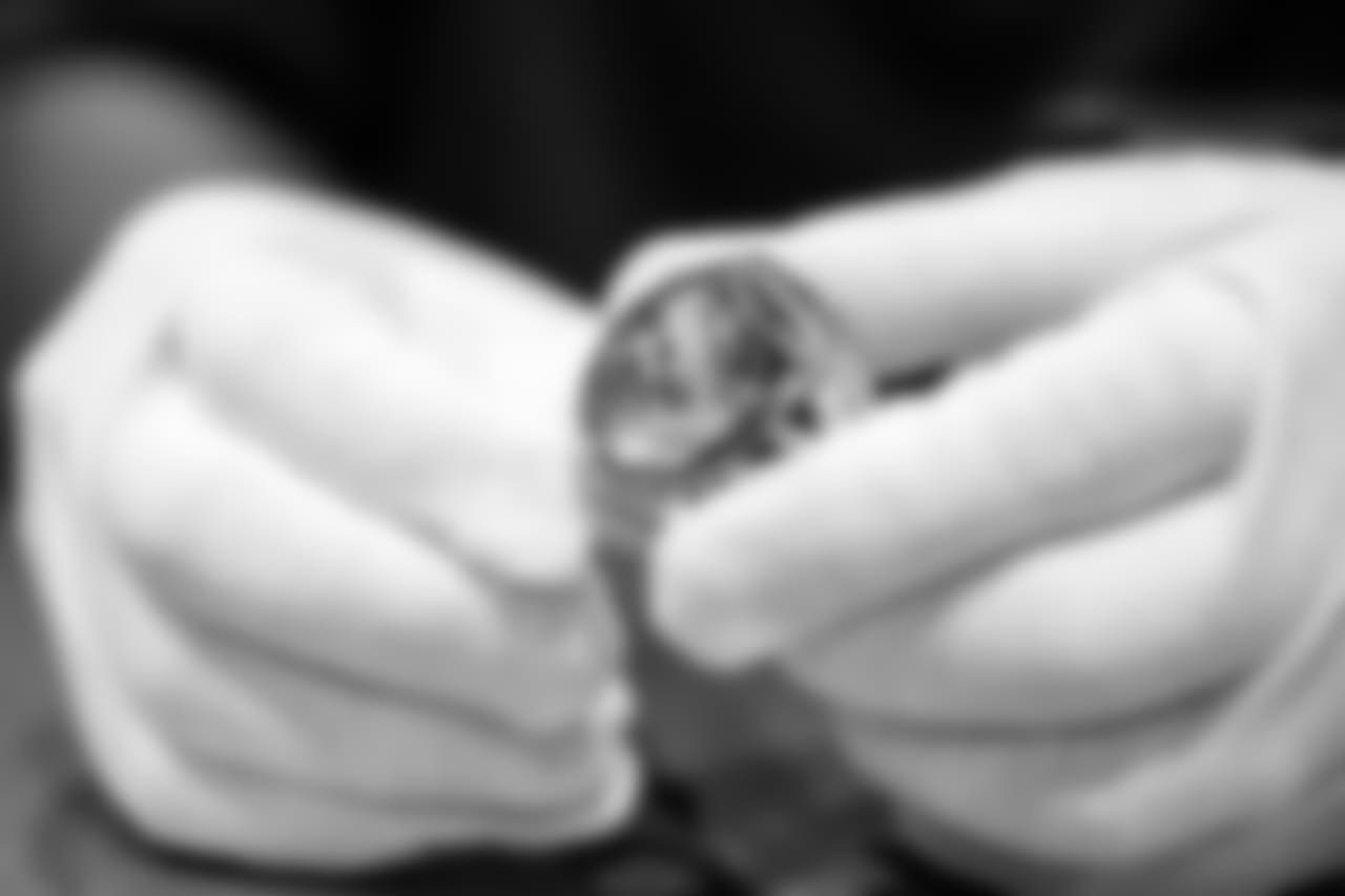 The top inside of the ring is inscribed with an image of an underdog mask