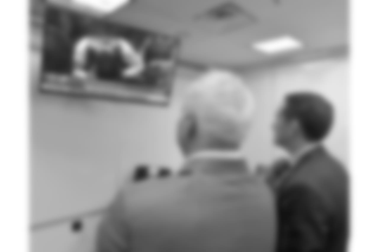 Jeffrey Lurie and Howie Roseman watch the broadcast as the Eagles' first-round pick is announced