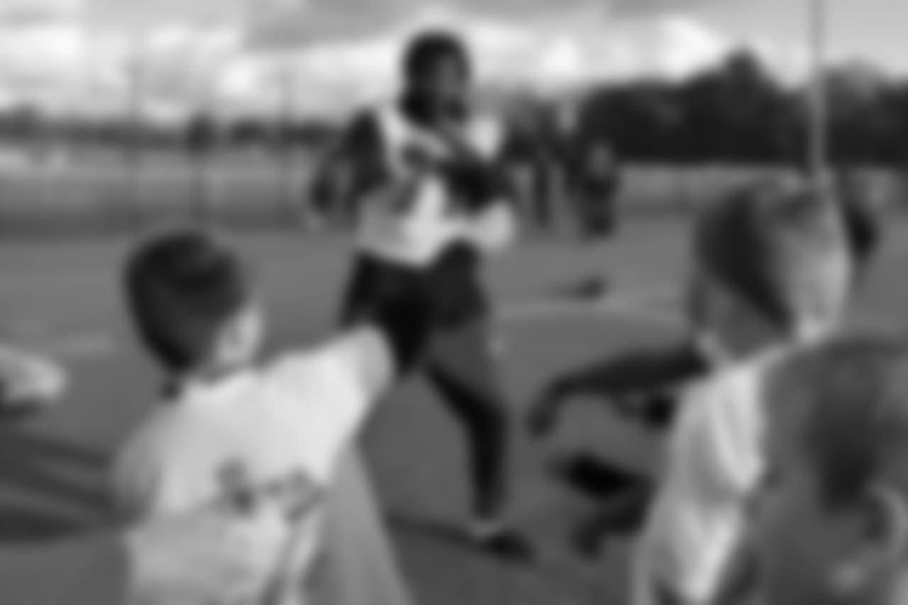 DE Michael Bennett helping the kids get excited