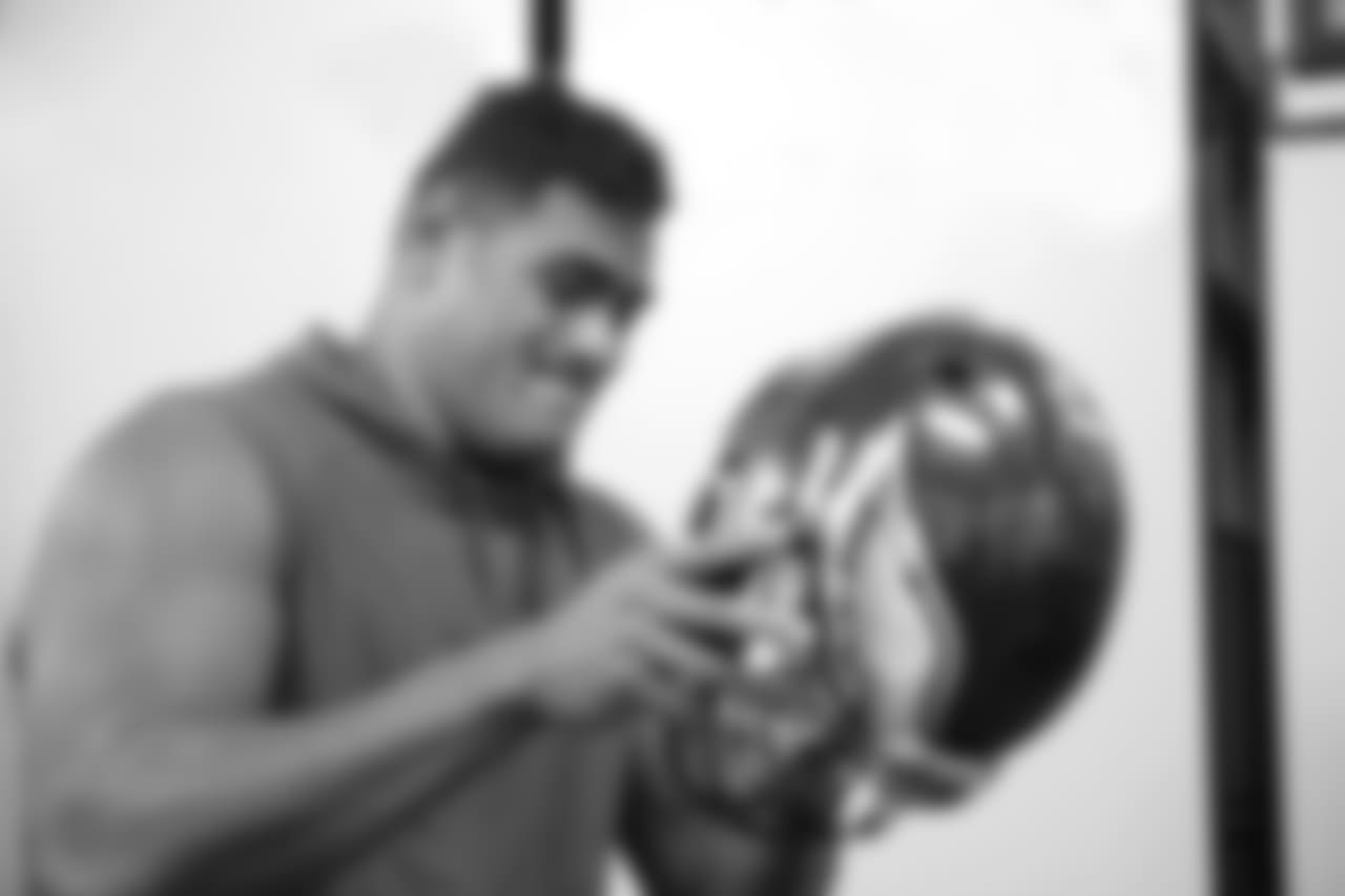 Mailata tries on an Eagles helmet for the first time.