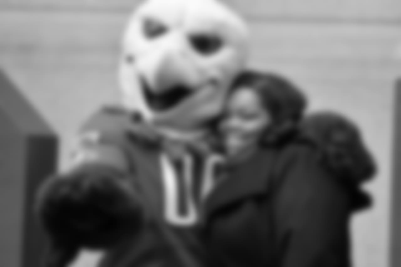 SWOOP hugging another Eagles fan