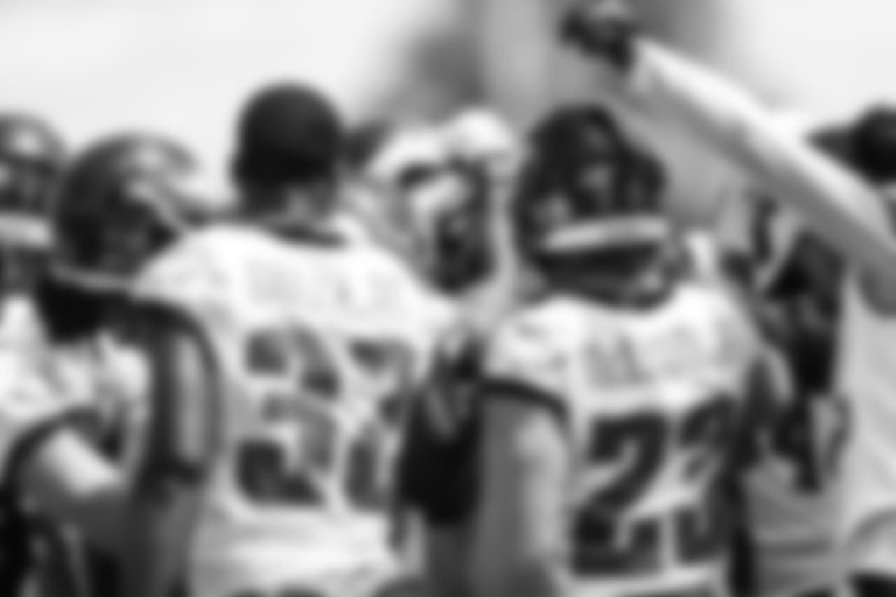 The Eagles defensive backs huddle up.