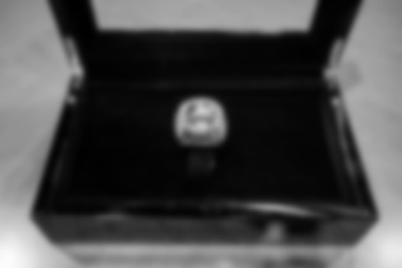 The ring is made of 10-karat white gold and features 219 diamonds and 17 genuine green sapphires