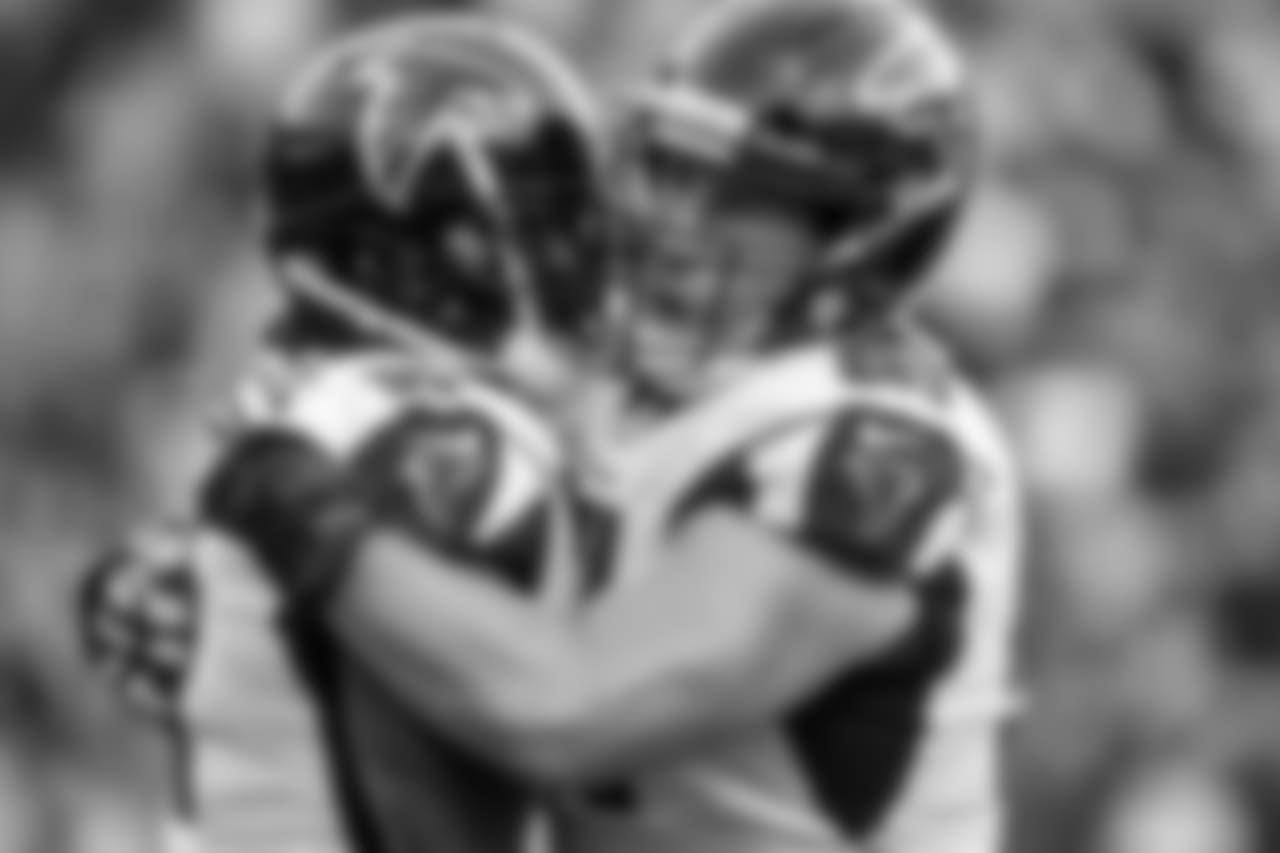 WR Julio Jones is embraced by C Alex Mack