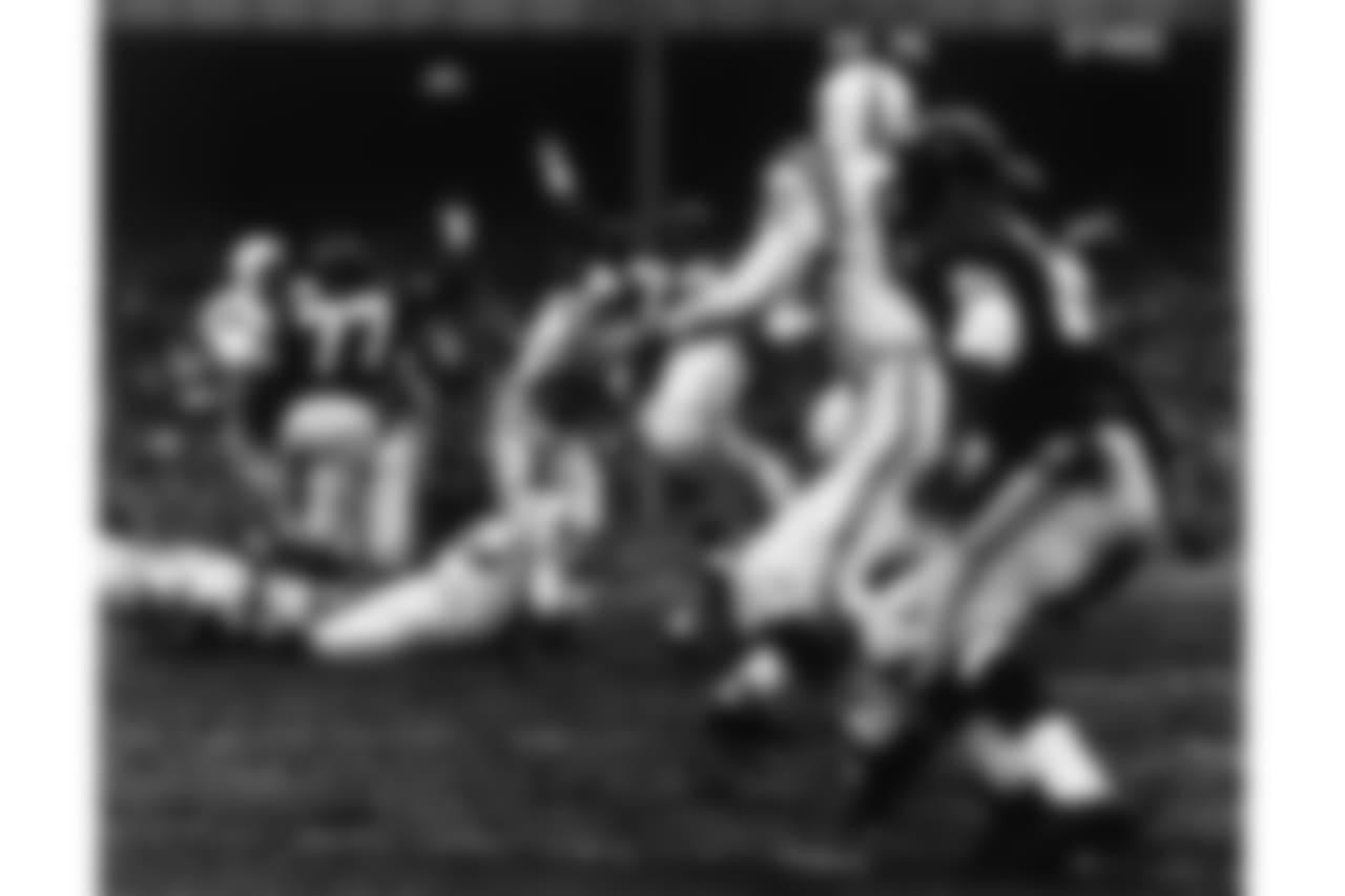 Baltimore Colts Hall of Fame quarterback Johhny Unitas (19) throws to end Raymond Berry (82) in a 23 to 17 Baltimore Colts overtime win over the New York Giants in the 1958 NFL Championship game played at Yankee Stadium on Dec. 28, 1958 in Bronx, New York. (AP Photo/NFL Photos)