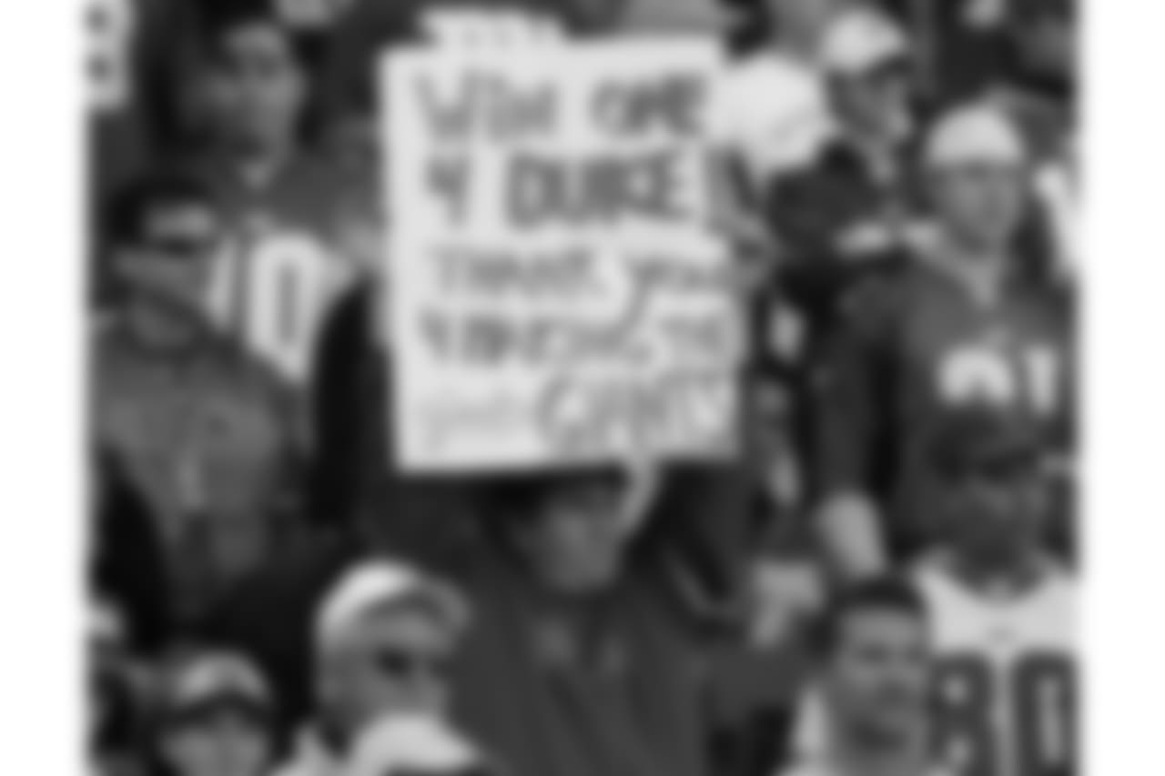 A New York Giants fan holds up a sign in tribute to Giants owner Wellington Mara, who died Tuesday at age 89, before the Giants shutout the Washington Redskins 36-0, Sunday, Oct. 30, 2005, at Giants Stadium in East Rutherford, N.J. (AP Photo/Kathy Willens)