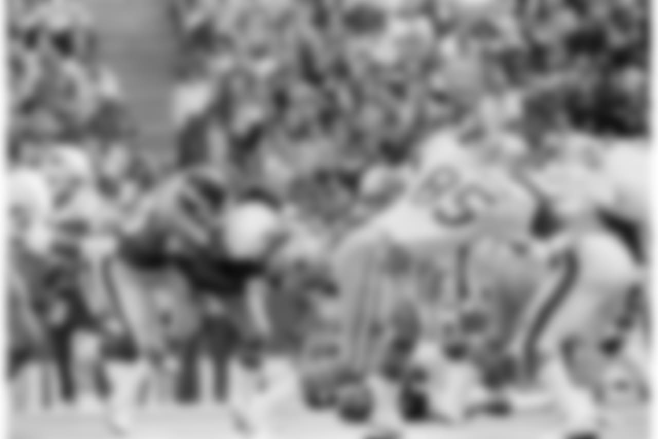 Dallas Cowboys quarterback Gary Hogeboom (14) is sacked by New York Giants defensive end Leonard Marshall for a loss of ten yards in the third quarter, Nov. 4, 1984 at Irving, Texas. New York won the game 19-7. (AP Photo/Nuri Vallbona)