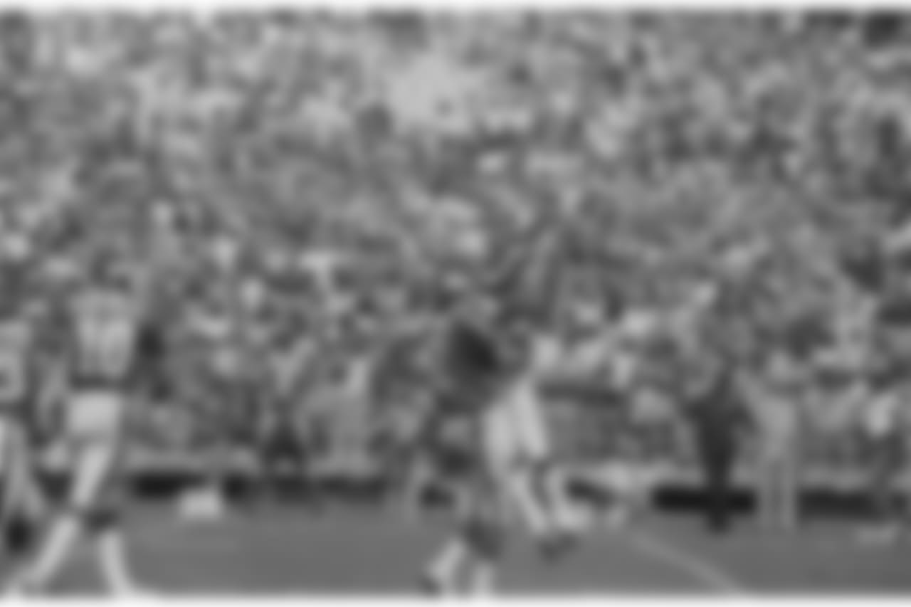 New York Giants kicker Ali Haji-Sheikh (6) leaps into the arms of quarterback Scott Brunner after kicking a 30-yard field goal to beat the Atlanta Falcons 16-13 at Atlanta Fulton County Stadium in sudden death overtime, Sept. 11, 1983. He kicked two other field goals and an extra point in their game. (AP Photo/Charles Kelly)