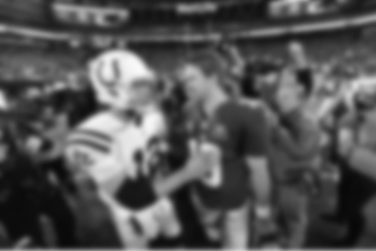 Indianapolis Colts quarterback Andrew Luck (12) talks with New York Giants quarterback Eli Manning (10) after a week 9 football game against the Indianapolis Colts on November 3, 2014 in East Rutherford, New Jersey
(AP Photo/Evan Pinkus)